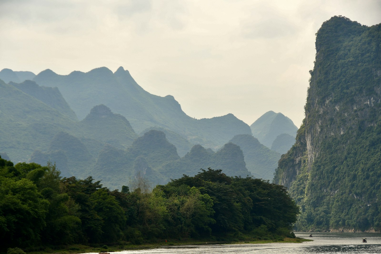 The Li River winding between forested limestone peaks in the Guilin region