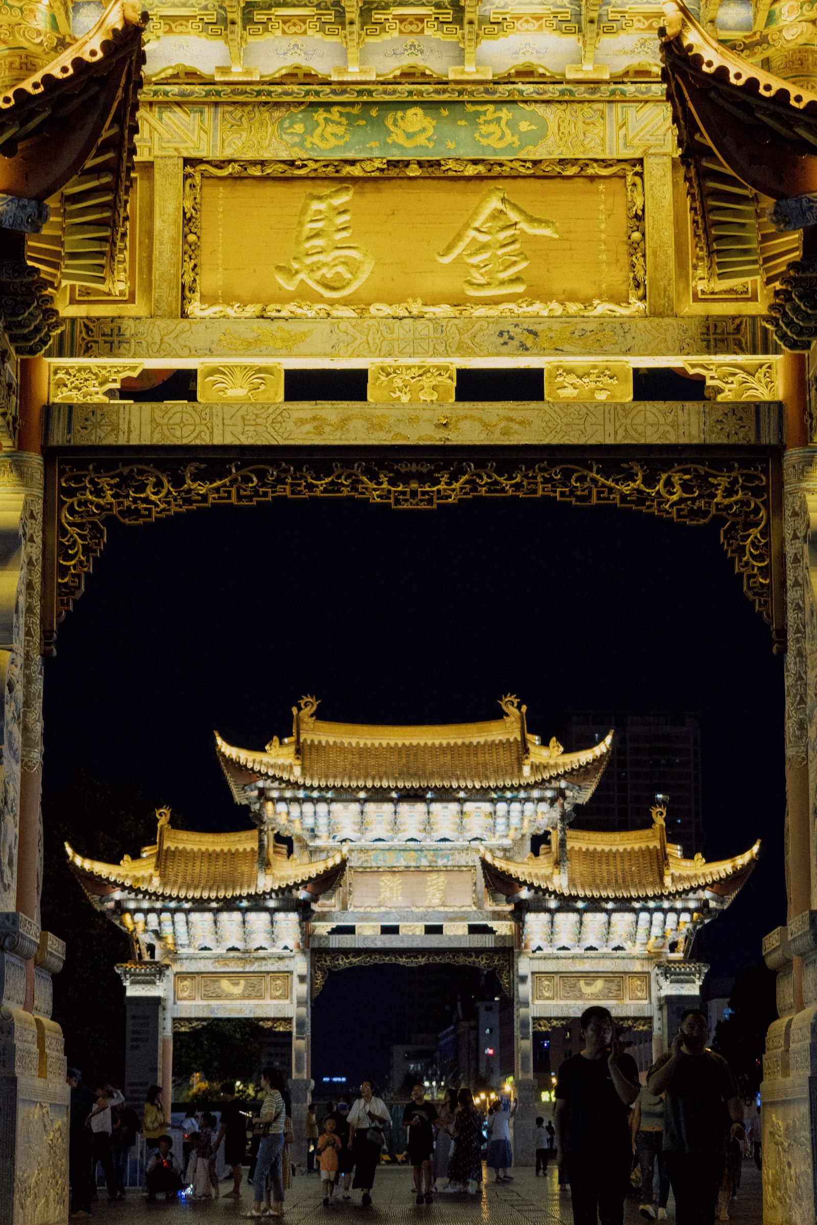 Kunming’s illuminated Golden Horse and Jade Rooster gateways at night
