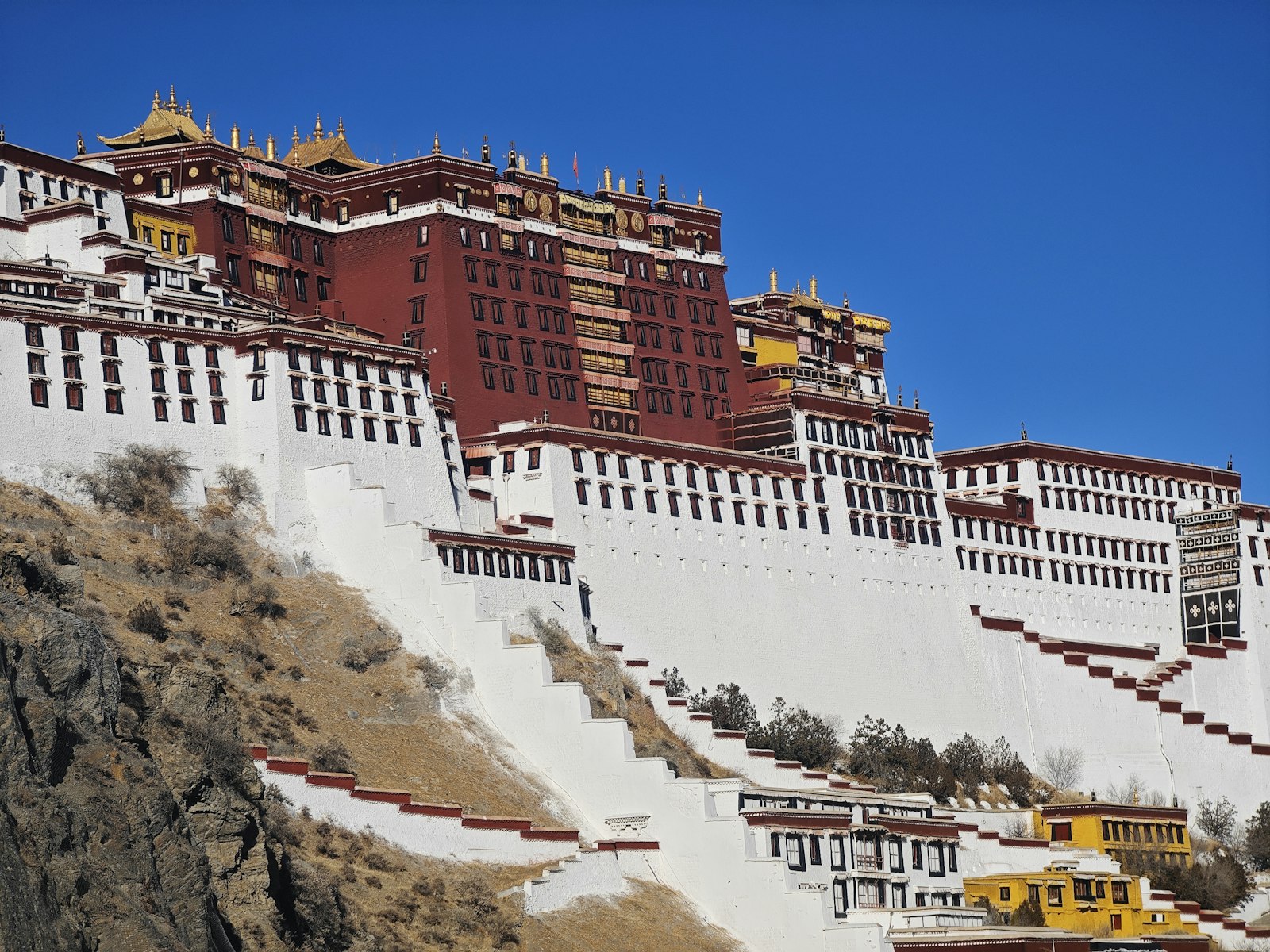 The Potala Palace’s red and white walls above Lhasa