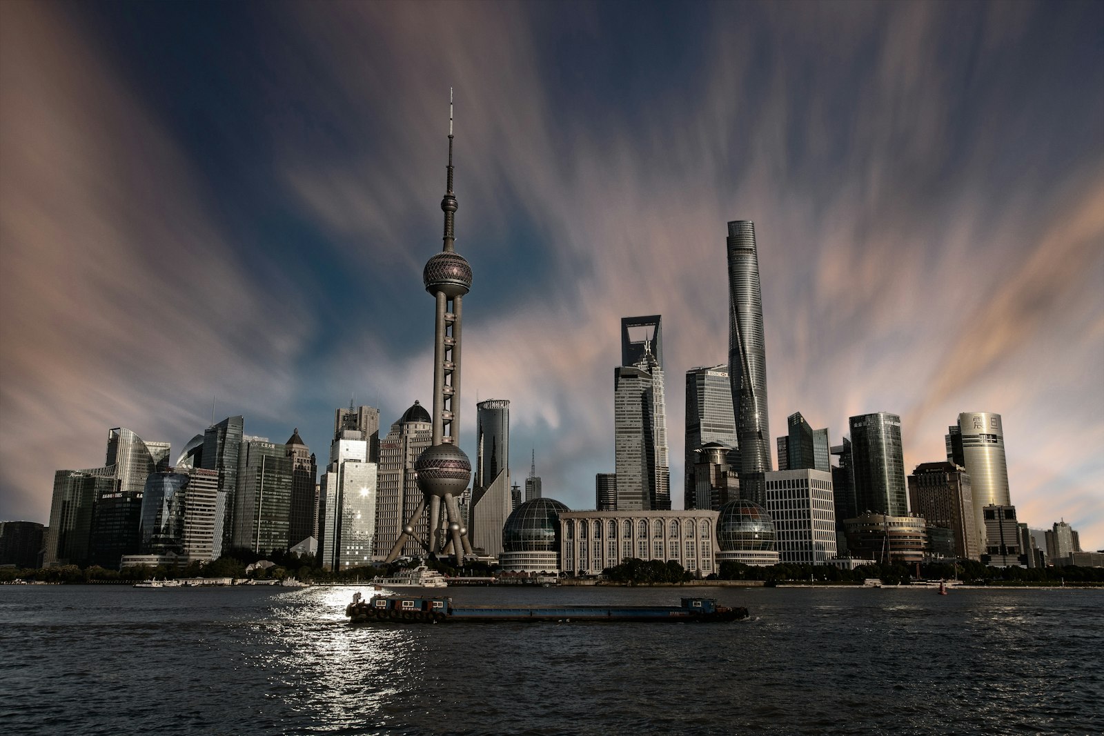 Shanghai’s Pudong skyline and Oriental Pearl Tower across the Huangpu River