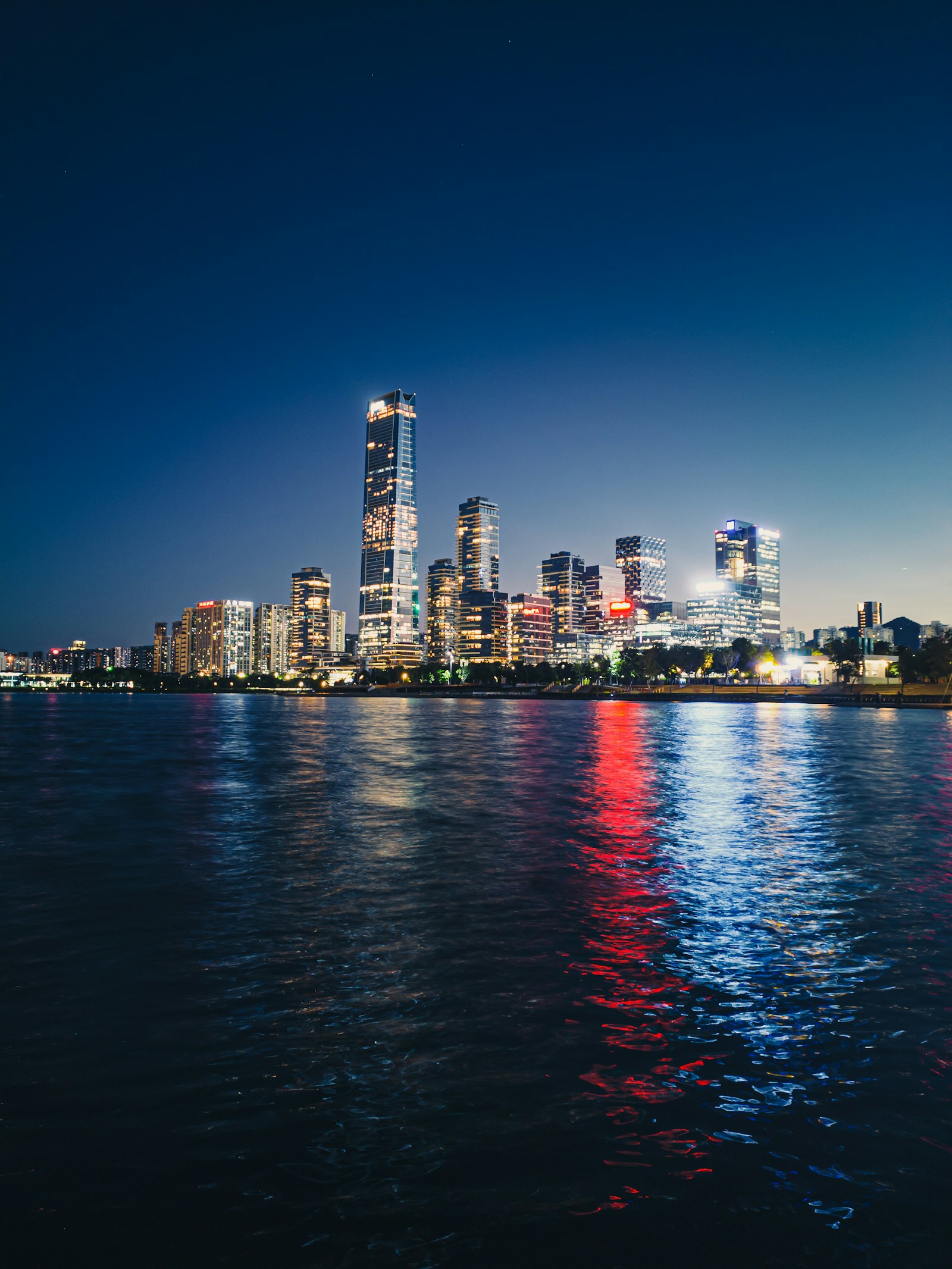 Shenzhen’s illuminated waterfront skyline reflected in the water at night