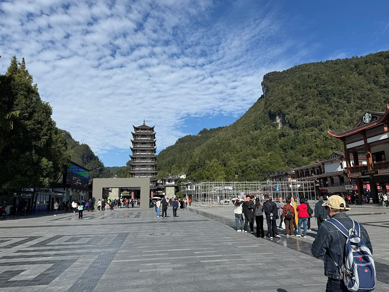 The tall pagoda-shaped landmark and broad plaza at Wulingyuan East Gate