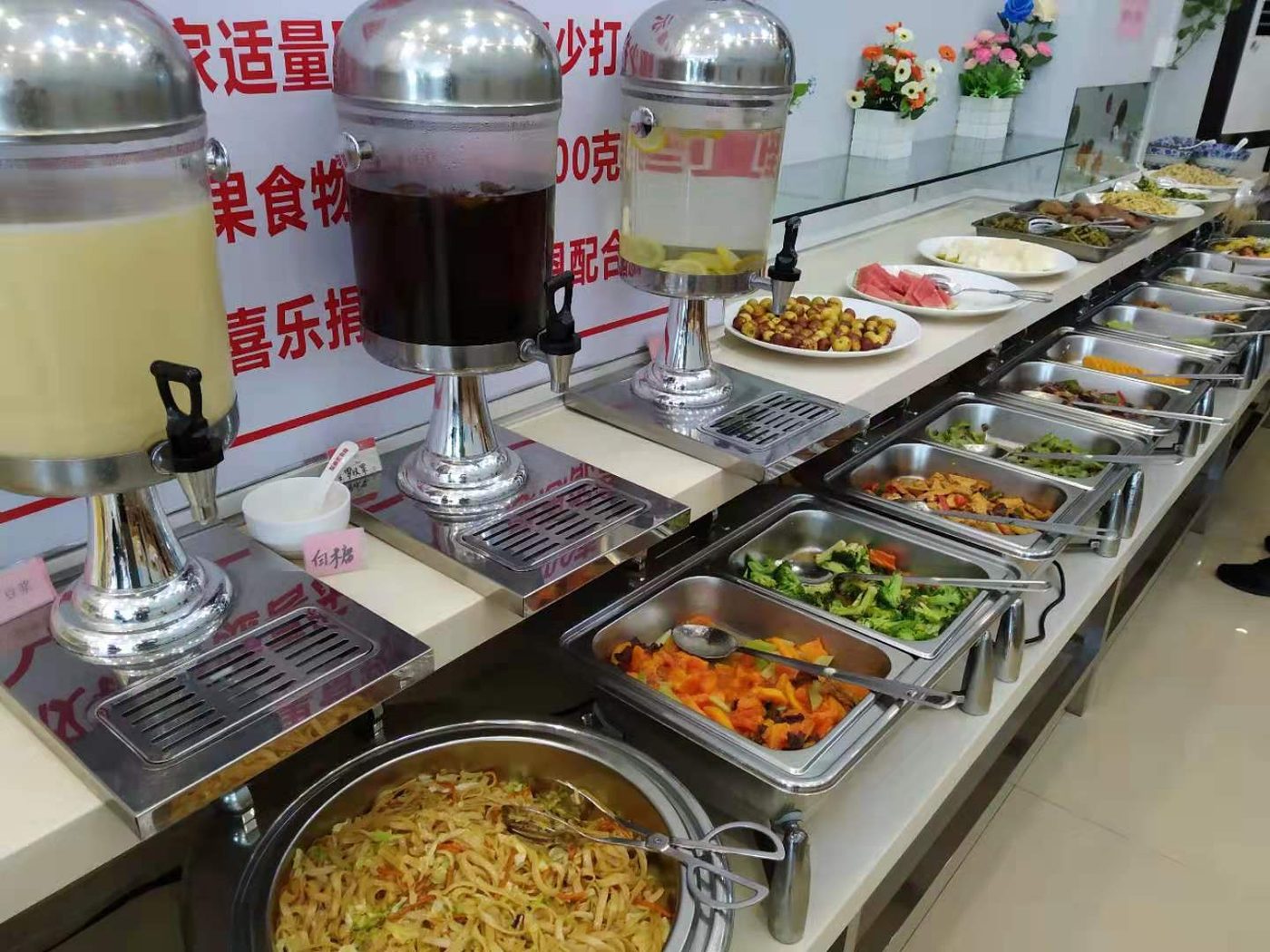 Vegetable dishes, noodles and drinks at a vegetarian buffet in Shenzhen
